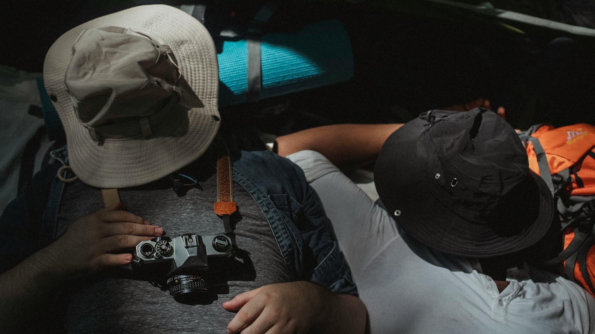 Tired faceless men sleeping in camp tent by Kamaji Ogino